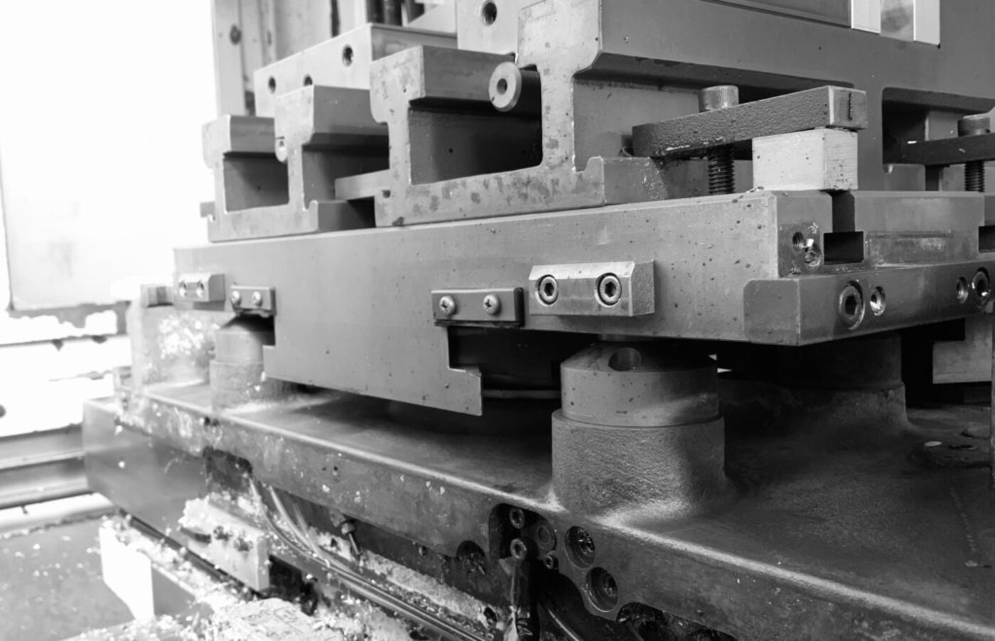 Precision machine fixture and tooling on a CNC machine bed
